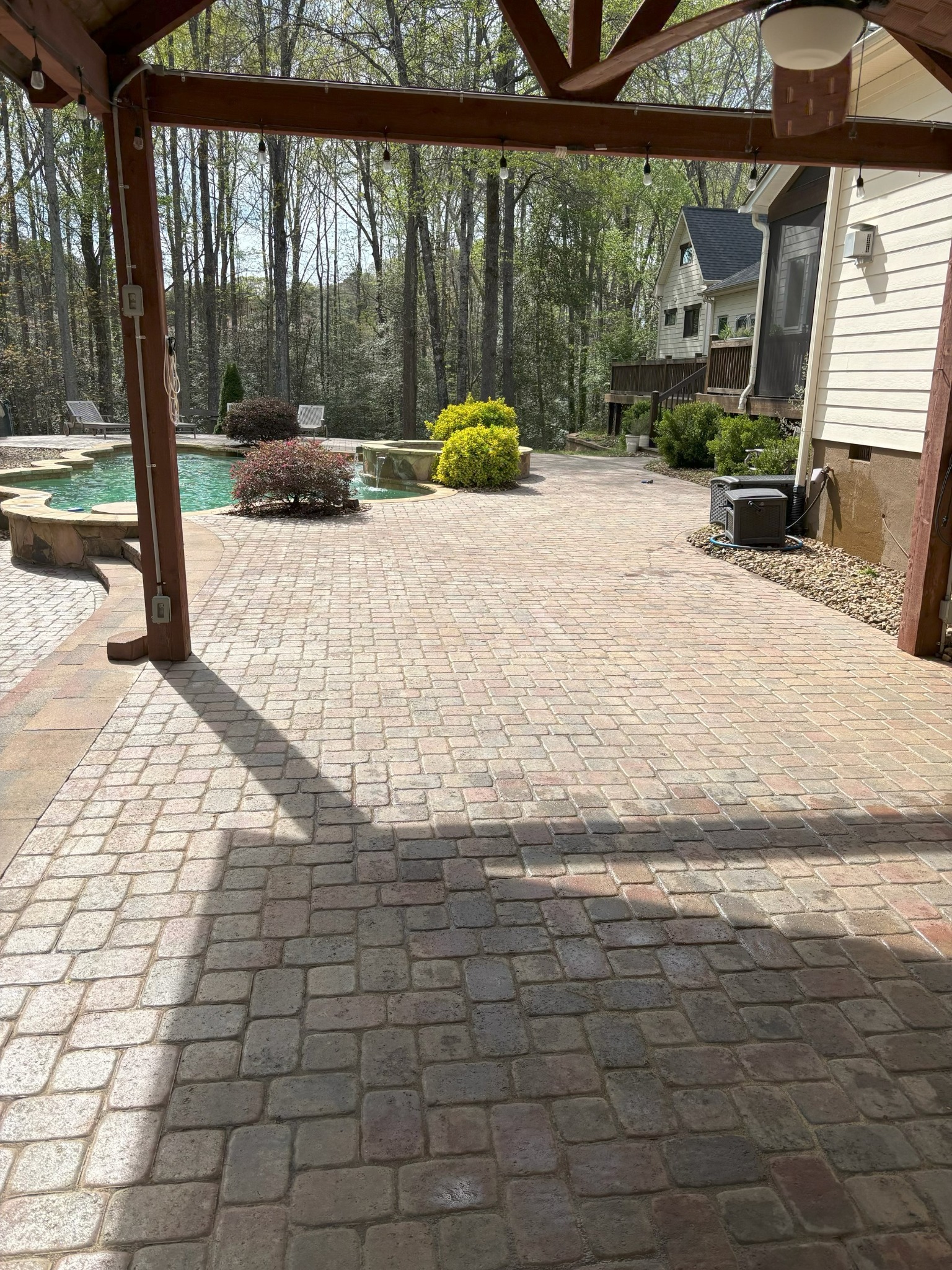 Clean and sealed paver patio and pool area